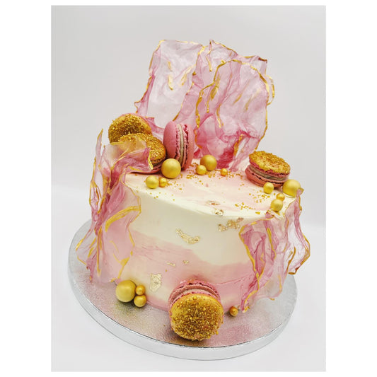 pink cake with rice paper decorations