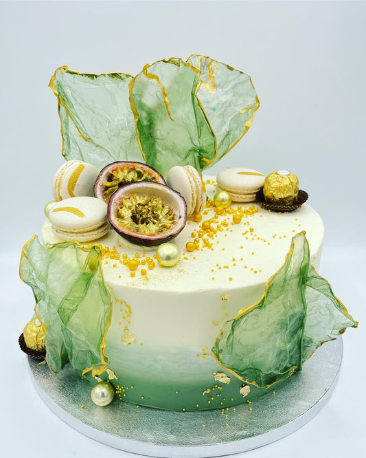 Green birthday cake with rice paper decorations