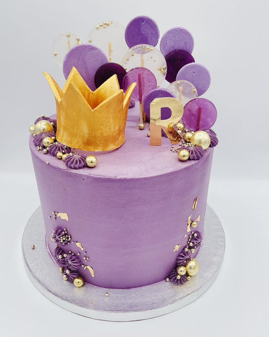 Purple cake with gold crown